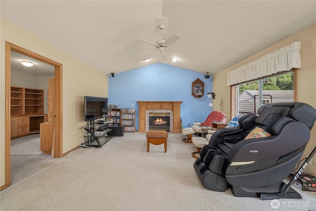6610 227th Street Ct E, Spanaway, WA 98387 - living room with vaulted ceiling, carpet flooring, ceiling fan, and a tiled fireplace