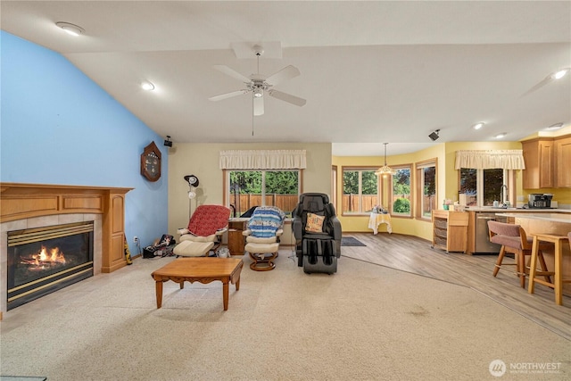 6610 227th Street Ct E, Spanaway, WA 98387 - living area with a fireplace, lofted ceiling, recessed lighting, a ceiling fan, and light wood-type flooring