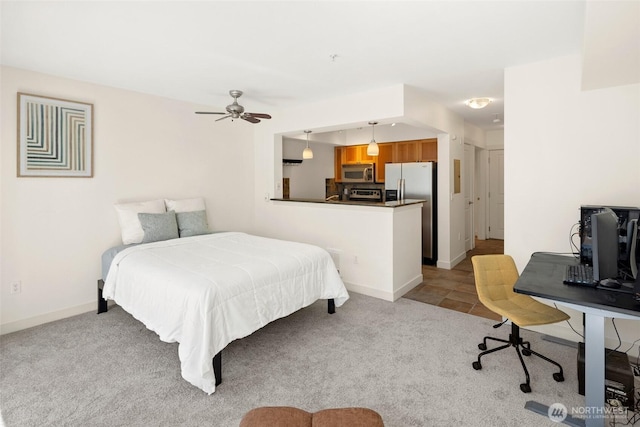 1545 NW 57th St Unit 423, Seattle, WA 98107 - bedroom featuring stainless steel fridge, light colored carpet, and baseboards