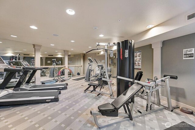 1545 NW 57th St Unit 423, Seattle, WA 98107 - gym with ornate columns, carpet, recessed lighting, and baseboards