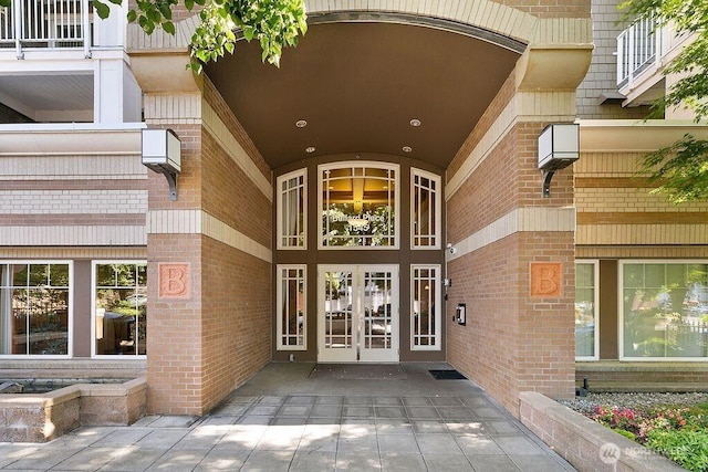 1545 NW 57th St Unit 423, Seattle, WA 98107 - view of exterior entry with brick siding and french doors