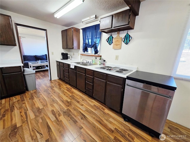 119 N 16th St, Elma, WA 98541 - kitchen featuring dishwasher, white electric cooktop, a sink, dark brown cabinetry, and light countertops