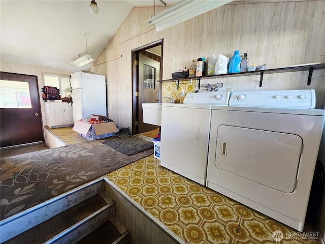 119 N 16th St, Elma, WA 98541 - laundry area featuring separate washer and dryer and wooden walls