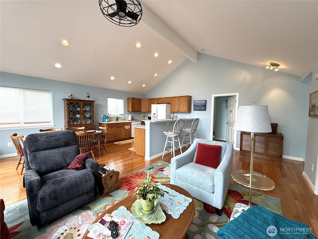762 Evergreen Ave SE, Ocean Shores, WA 98569 - living room with light wood-style floors, beam ceiling, recessed lighting, healthy amount of natural light, and high vaulted ceiling