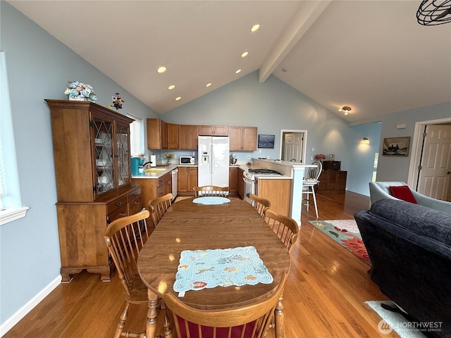 762 Evergreen Ave SE, Ocean Shores, WA 98569 - dining area with light wood-type flooring, beamed ceiling, high vaulted ceiling, and recessed lighting