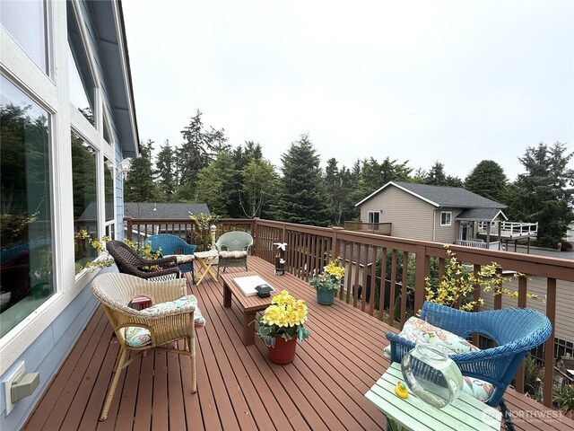 762 Evergreen Ave SE, Ocean Shores, WA 98569 - wooden deck featuring an outdoor hangout area