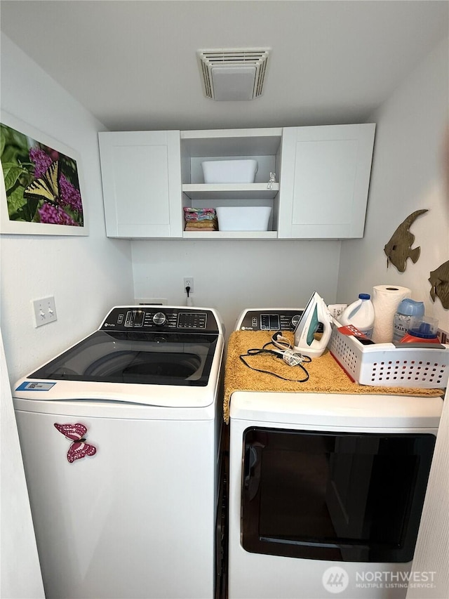 762 Evergreen Ave SE, Ocean Shores, WA 98569 - laundry room with cabinet space and washer and dryer