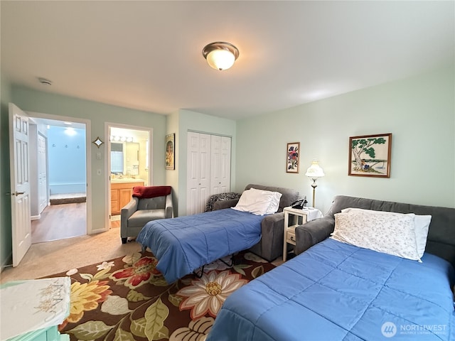762 Evergreen Ave SE, Ocean Shores, WA 98569 - bedroom with light colored carpet, a closet, and connected bathroom