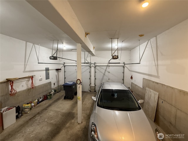 762 Evergreen Ave SE, Ocean Shores, WA 98569 - garage with electric panel and a garage door opener
