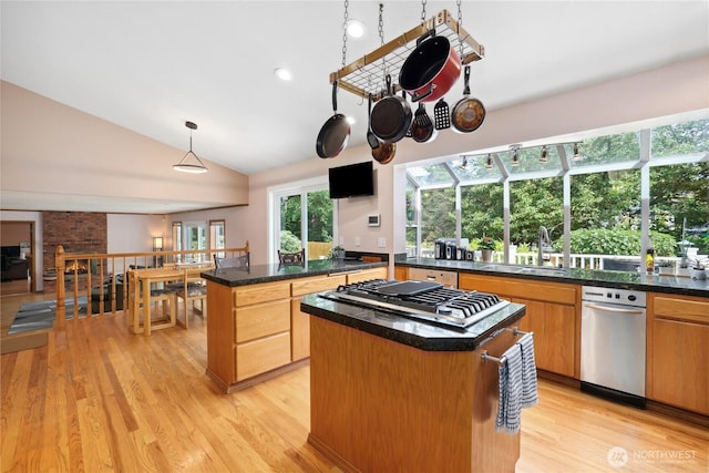 1612 SW 304th St, Federal Way, WA 98023 - kitchen with a center island, stainless steel gas cooktop, light wood finished floors, dark countertops, and lofted ceiling
