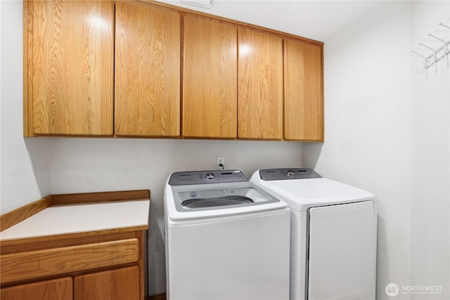 1612 SW 304th St, Federal Way, WA 98023 - washroom featuring cabinet space and washer and clothes dryer