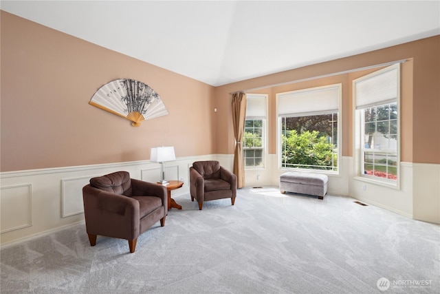 1612 SW 304th St, Federal Way, WA 98023 - living area featuring wainscoting, carpet floors, lofted ceiling, and a decorative wall