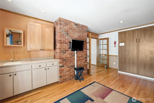 1612 SW 304th St, Federal Way, WA 98023 - unfurnished living room with ornamental molding, light wood-type flooring, and recessed lighting
