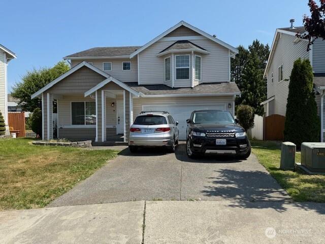 728 95th Ct SE, Everett, WA 98208 - view of front of home featuring concrete driveway, an attached garage, and a porch