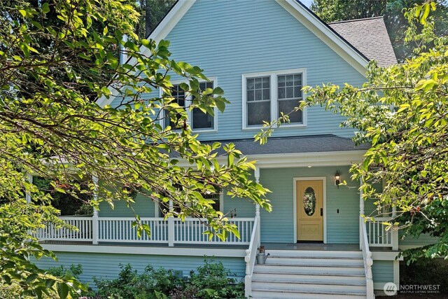 5940 Rose Loop NE, Bainbridge Island, WA 98110 - view of front of home with a shingled roof and a porch