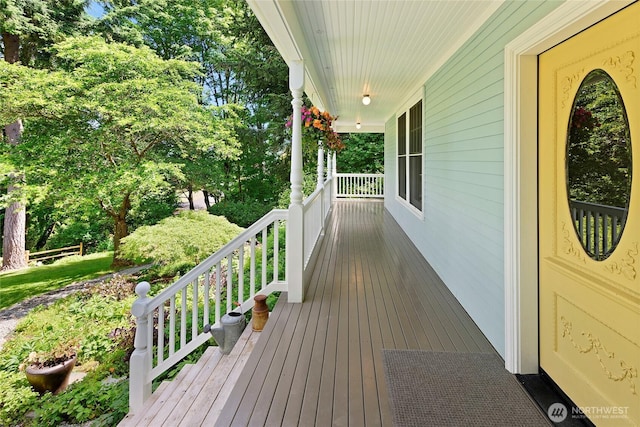 5940 Rose Loop NE, Bainbridge Island, WA 98110 - wooden porch featuring view of scattered trees