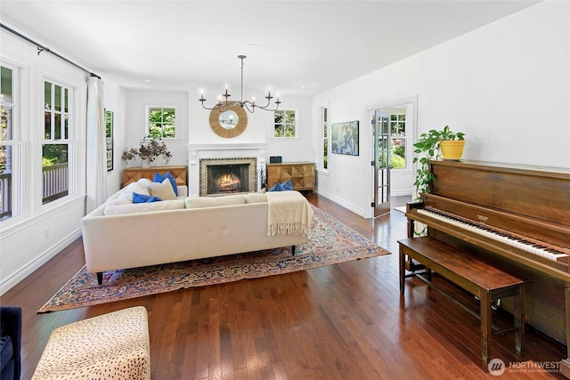5940 Rose Loop NE, Bainbridge Island, WA 98110 - living room with hardwood / wood-style floors, healthy amount of natural light, and a chandelier
