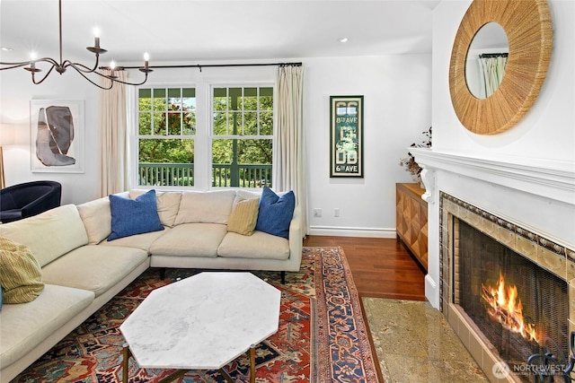 5940 Rose Loop NE, Bainbridge Island, WA 98110 - living room featuring a warm lit fireplace, a chandelier, wood finished floors, and recessed lighting