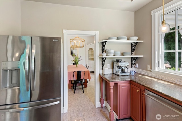 5940 Rose Loop NE, Bainbridge Island, WA 98110 - kitchen featuring stainless steel appliances, open shelves, dark stone counters, a chandelier, and granite tiled floors