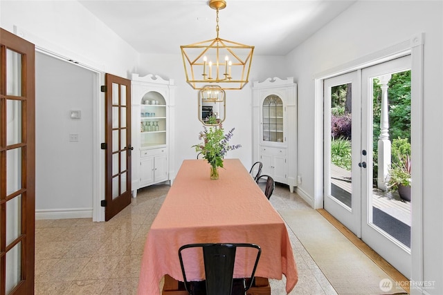 5940 Rose Loop NE, Bainbridge Island, WA 98110 - dining area with french doors and a chandelier