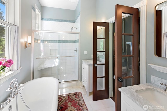 5940 Rose Loop NE, Bainbridge Island, WA 98110 - full bathroom featuring vanity, a shower stall, a freestanding tub, and tile patterned floors