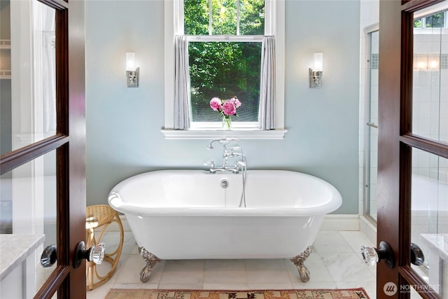 5940 Rose Loop NE, Bainbridge Island, WA 98110 - bathroom featuring french doors, a freestanding bath, and vanity