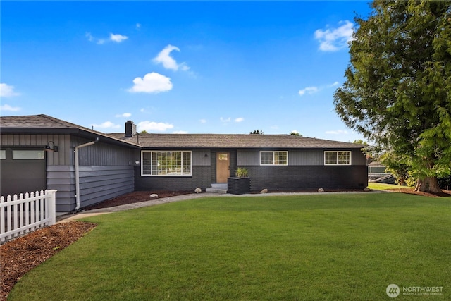 632 Valley Ave, Sumner, WA 98390 - ranch-style home with an attached garage, a chimney, brick siding, and board and batten siding
