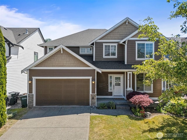 1208 Goldfinch Ave SW, Orting, WA 98360 - craftsman inspired home featuring driveway, an attached garage, a front yard, stone siding, and a shingled roof