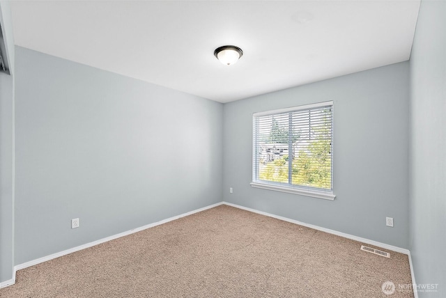 1208 Goldfinch Ave SW, Orting, WA 98360 - carpeted spare room with baseboards