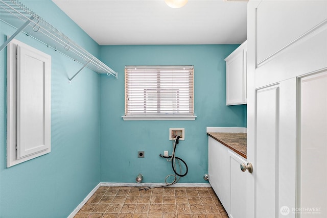 1208 Goldfinch Ave SW, Orting, WA 98360 - washroom with washer hookup, electric dryer hookup, and cabinet space