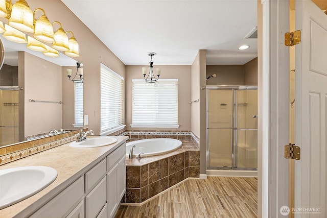 1208 Goldfinch Ave SW, Orting, WA 98360 - full bath featuring a bath, wood finished floors, a shower stall, and double vanity