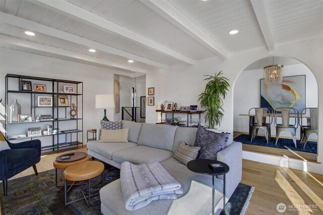 2219 Fairview Ave E Unit 5, Seattle, WA 98102 - living area with arched walkways, wood finished floors, a chandelier, recessed lighting, and beamed ceiling