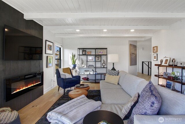 2219 Fairview Ave E Unit 5, Seattle, WA 98102 - living room featuring wood finished floors, a large fireplace, and wooden ceiling with exposed beams