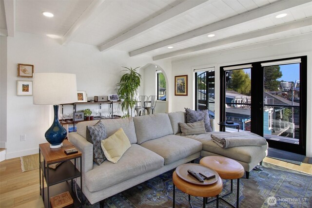 2219 Fairview Ave E Unit 5, Seattle, WA 98102 - living area featuring wood finished floors, recessed lighting, arched walkways, beam ceiling, and baseboards