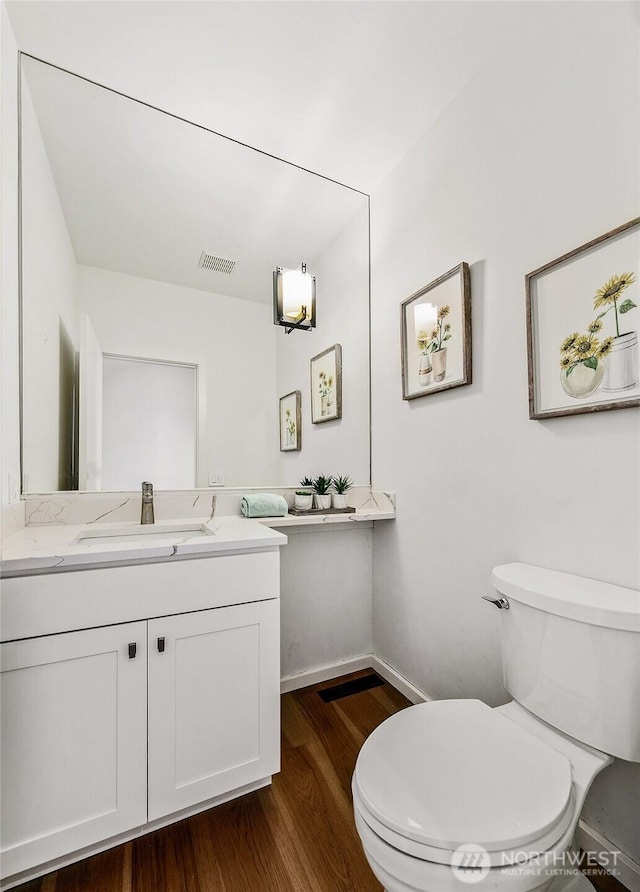 11115 NE 95th St, Kirkland, WA 98033 - bathroom featuring toilet, wood finished floors, vanity, and baseboards