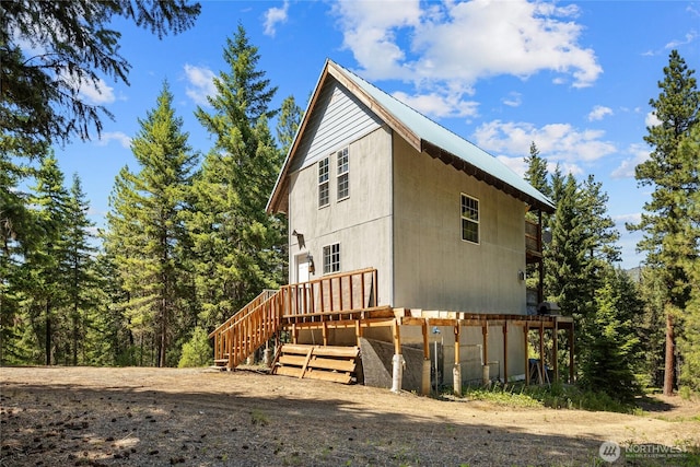 1131 Sandy Ridge Rd, Cle Elum, WA 98922 - view of side of home featuring a deck and a metal roof