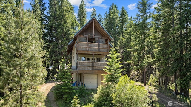 1131 Sandy Ridge Rd, Cle Elum, WA 98922 - back of property with a balcony and a forest view