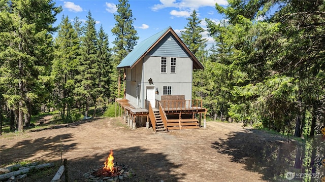 1131 Sandy Ridge Rd, Cle Elum, WA 98922 - rear view of property with a fire pit and a deck