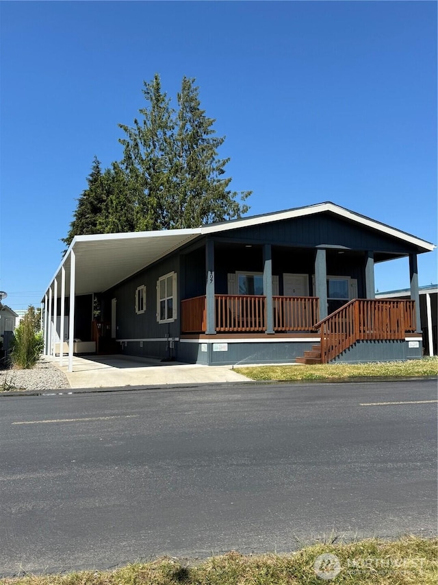 2101 S 324th St Unit 107, Federal Way, WA 98003 - manufactured / mobile home featuring an attached carport