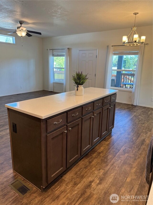 2101 S 324th St Unit 107, Federal Way, WA 98003 - kitchen with dark wood-style floors, ceiling fan, a chandelier, and plenty of natural light