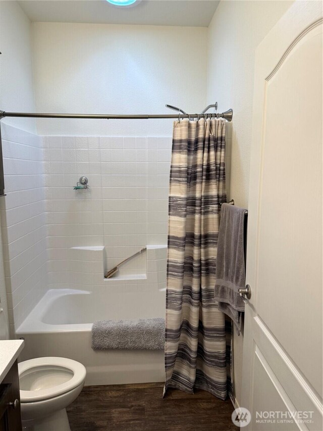 2101 S 324th St Unit 107, Federal Way, WA 98003 - bathroom with vanity, toilet, wood finished floors, and shower / bath combination with curtain
