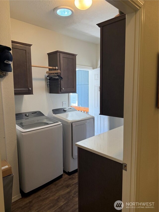 2101 S 324th St Unit 107, Federal Way, WA 98003 - laundry area featuring separate washer and dryer, cabinet space, and dark wood finished floors