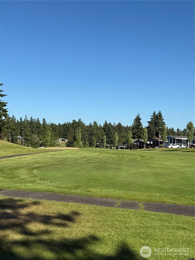 2101 S 324th St Unit 107, Federal Way, WA 98003 - view of property's community with a lawn and view of golf course