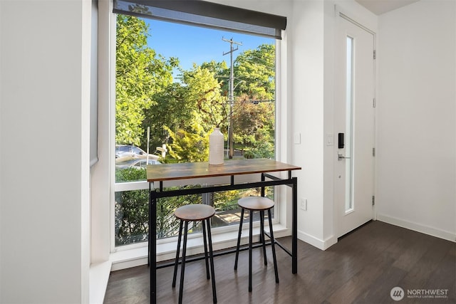 252 E Roanoke St, Seattle, WA 98102 - dining area featuring dark wood-style flooring and baseboards