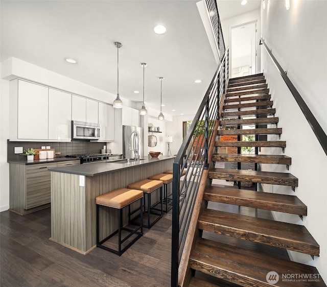 252 E Roanoke St, Seattle, WA 98102 - stairs featuring wood finished floors and recessed lighting