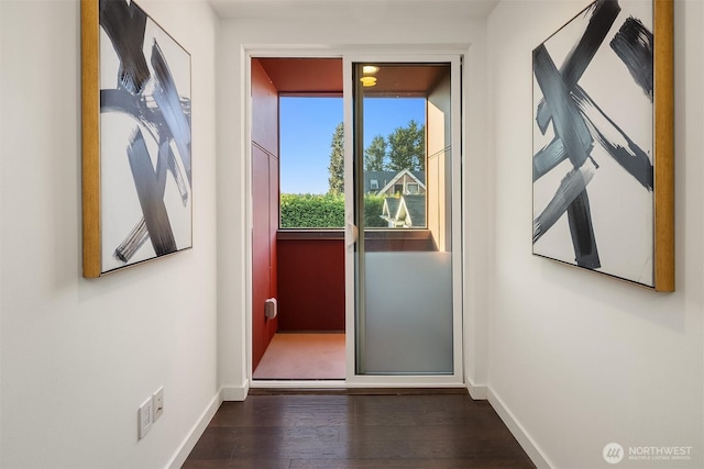 252 E Roanoke St, Seattle, WA 98102 - doorway featuring baseboards and wood finished floors