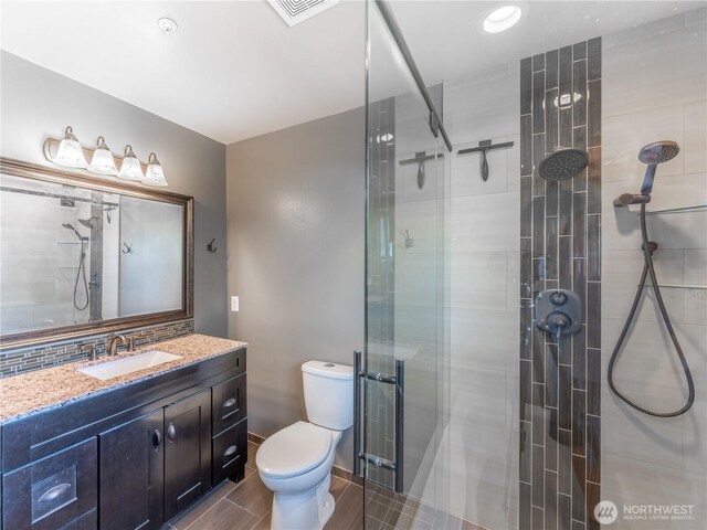 2422 Highland View Dr, East Wenatchee, WA 98802 - bathroom with toilet, a stall shower, and vanity