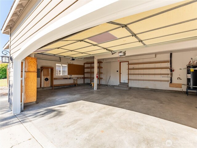 2422 Highland View Dr, East Wenatchee, WA 98802 - garage with a garage door opener and electric water heater