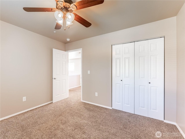 2422 Highland View Dr, East Wenatchee, WA 98802 - unfurnished bedroom featuring carpet flooring, baseboards, a closet, and a ceiling fan