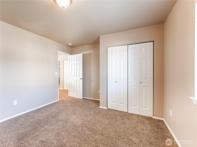 2422 Highland View Dr, East Wenatchee, WA 98802 - unfurnished bedroom featuring carpet, baseboards, and a closet